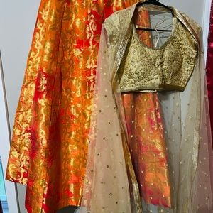 Orange brocade lehenga,gold blouse,net duppata